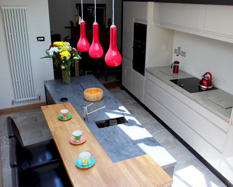 Colourful curved counter with display feature wall.