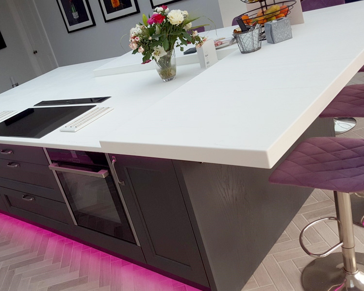 Curved Walnut counter with storage wall.